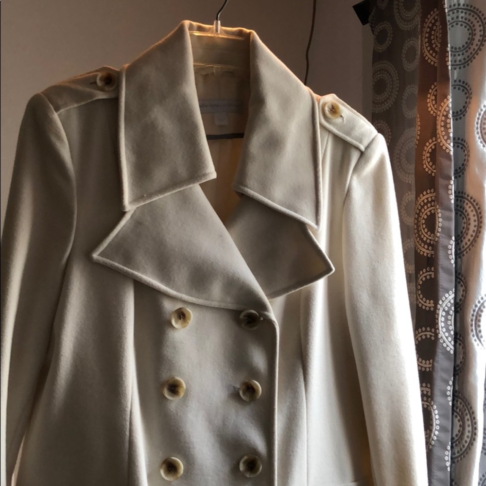 Cream colored double breasted coat